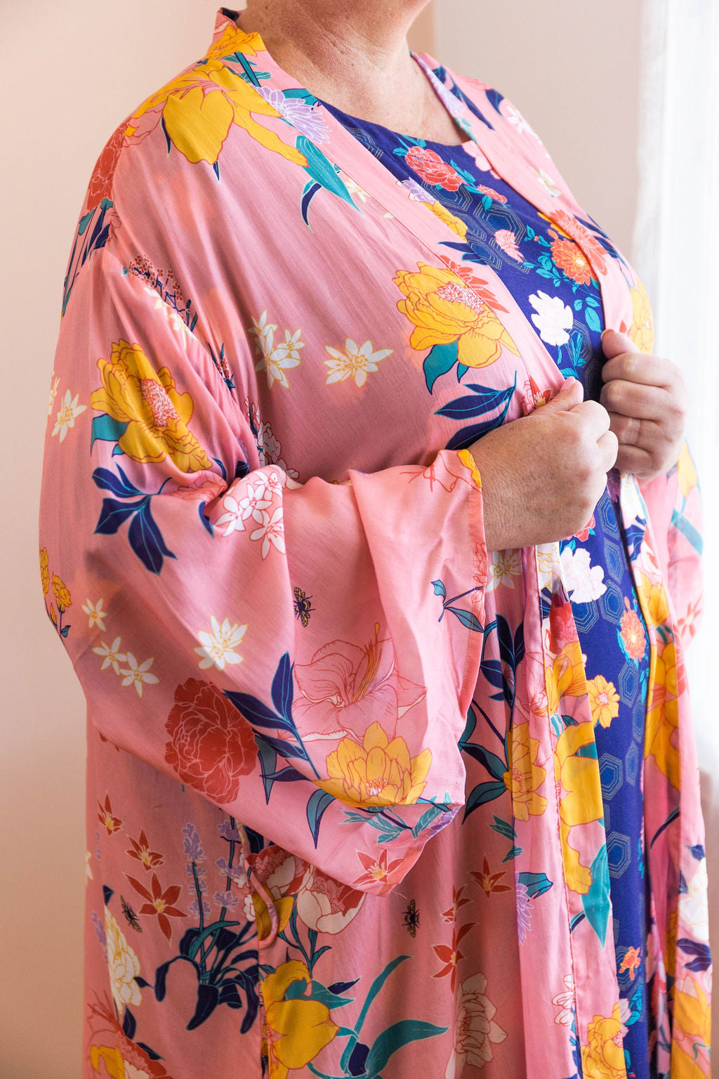 pink fiorella print chimono robe showing flowers and bees in the print