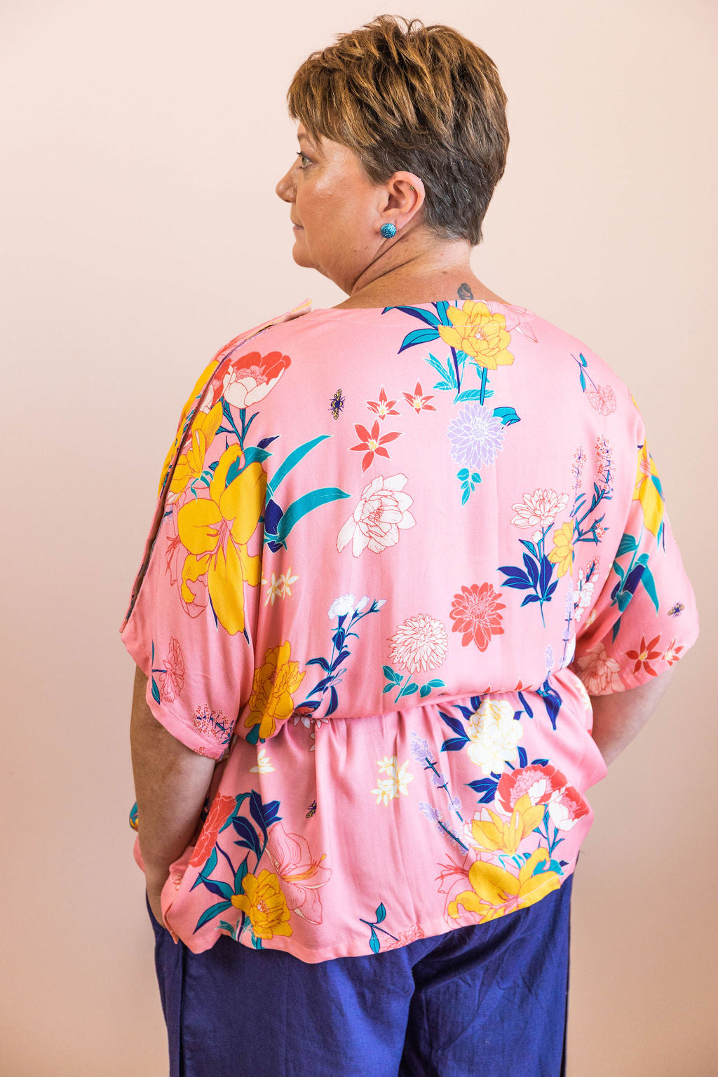 back view of limonata adaptive dolce top in pink fiorella print