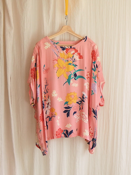 limonata pink fiorella floral print adaptive top hanging on a coathanger